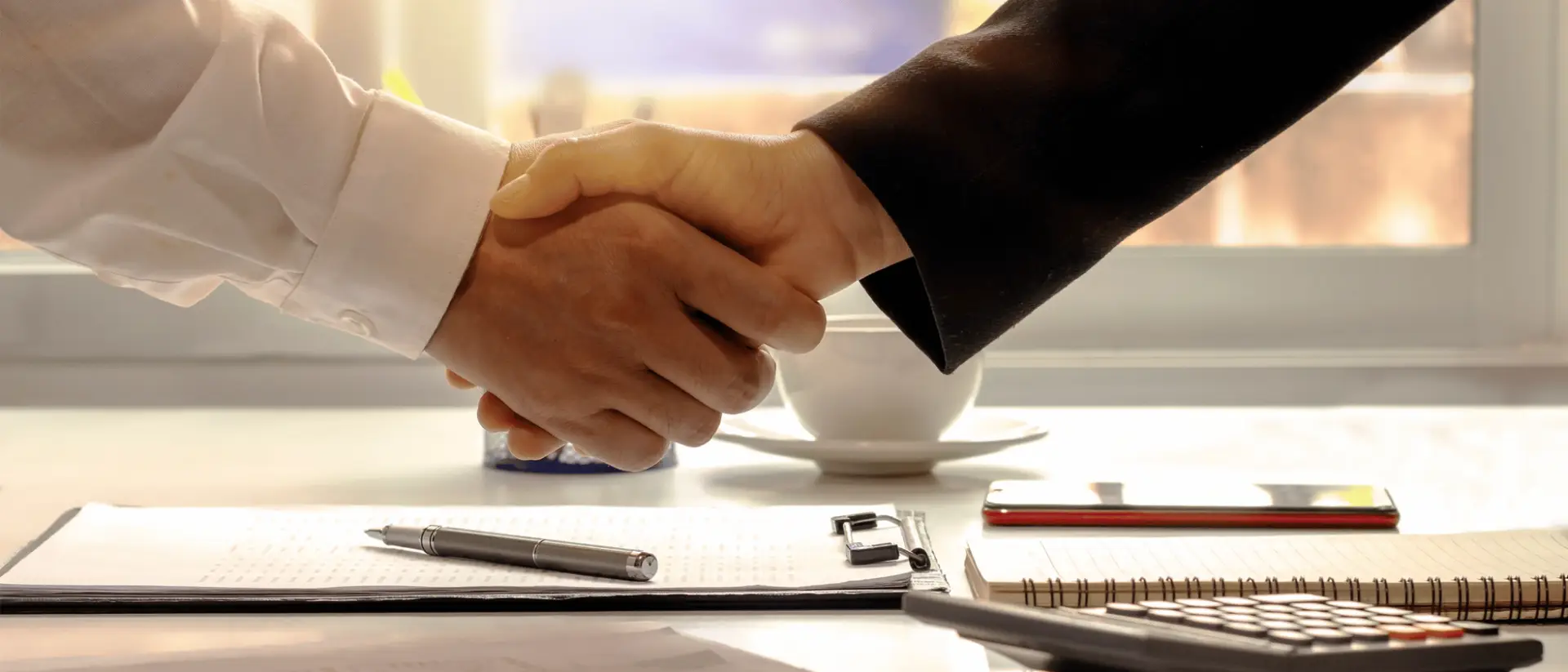 The Entrepreneurial Marketplace For Startup Investment at work with the investor and invest handshaking to proceed with funding a business startup.
