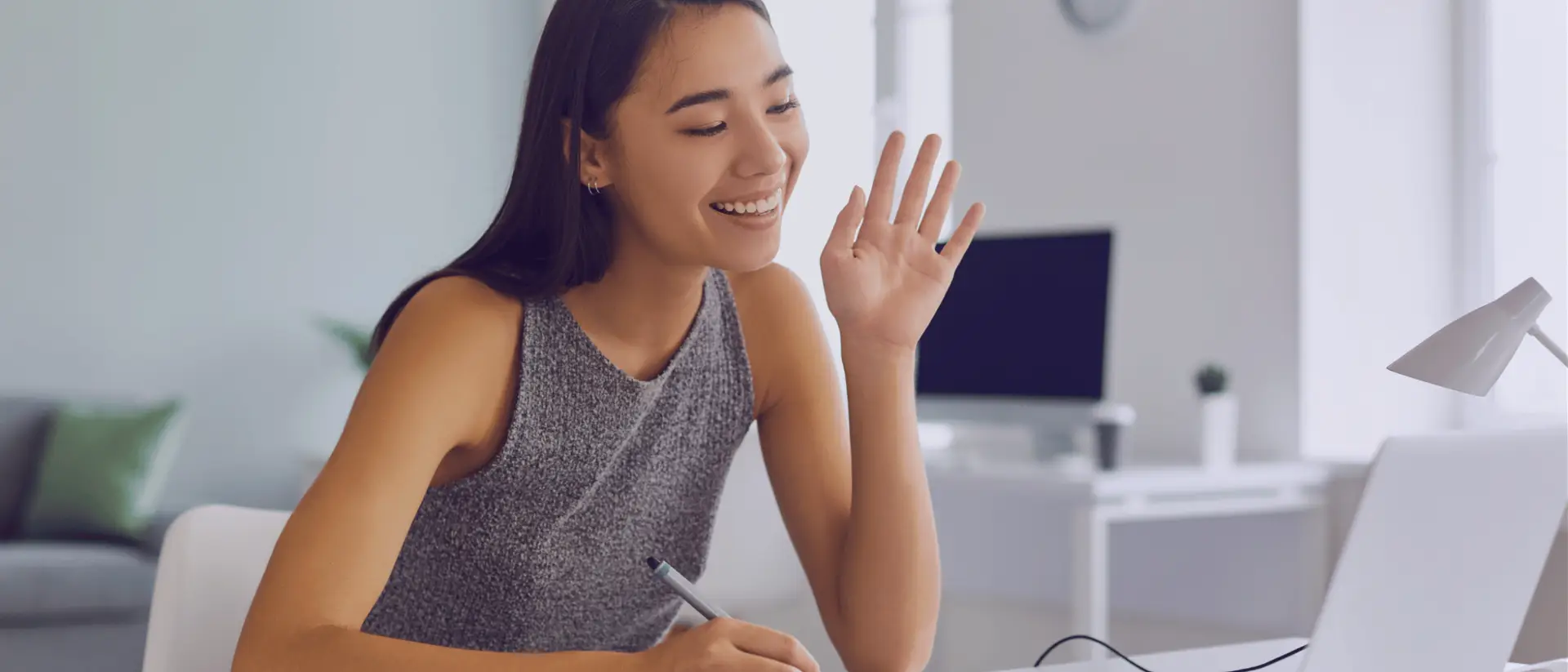 Contact Our Team Today as a happy female client on her laptop vid call with The Entrepreneurial CPA.